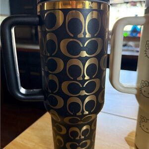 Gold and Black coach stanley 40 0z.